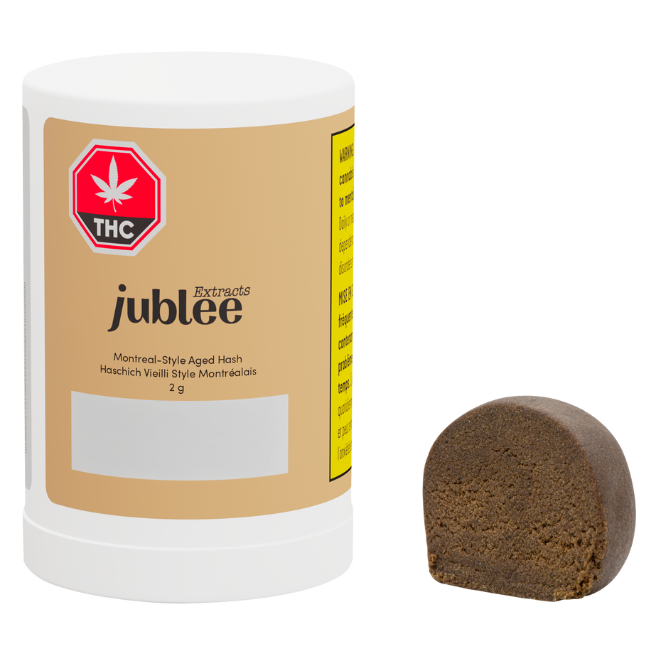 Jubilee cannabis product with a white container and brown hash on a white background