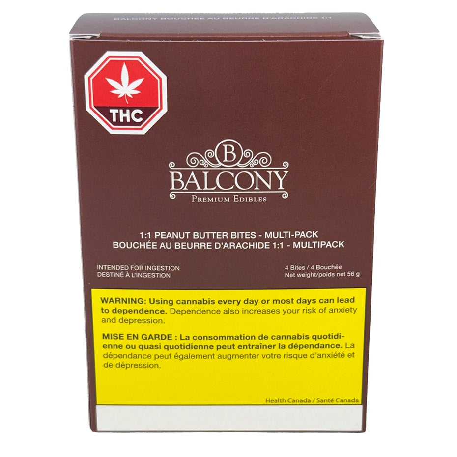 A box of balcony brand THC peanut butter bites multi-pack, featuring a dark brown packaging design with a yellow warning label and a red hexagonal THC logo.