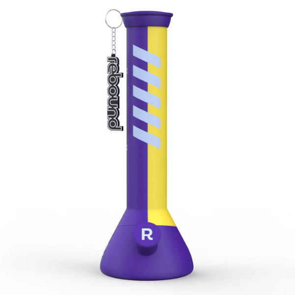 A silicone beaker-style water pipe with blue and yellow stripes on a purple base, featuring a glass bowl and the brand name 'Rebound' on the side.