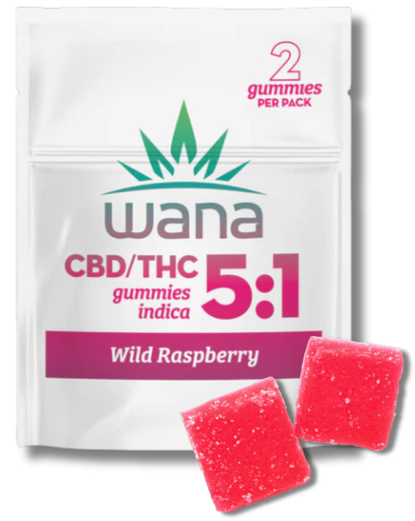 Packaging of Wana Wild Raspberry Gummies showing the product name and CBD/THC ratio, with two gummy candies in front.