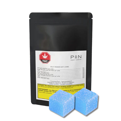 A black package labeled 'P&N' with a red cannabis leaf symbol, yellow label, and two blue-colored cannabis edibles in front.