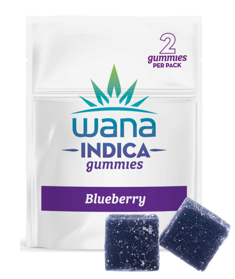 Packaging for Wana Blueberry Indica Gummies showing the product name and a visual representation of two gummy candies. The background is white with a purple and blue color scheme.