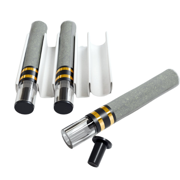 This image features the Azimuth Collective Sunset OP Infused Pre-Roll, presented in a sleek and appealing arrangement. The pre-roll itself is prominently displayed, with a stylish design consisting of a grey body accented by golden rings, providing a modern aesthetic.