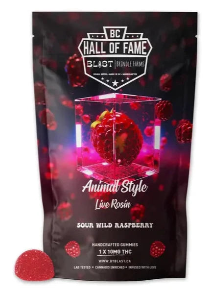 Packaging for Animal Style Live Rosin Sour Wild Raspberry gummy gummies with a prominent red raspberry on the front and a vibrant, purple background.