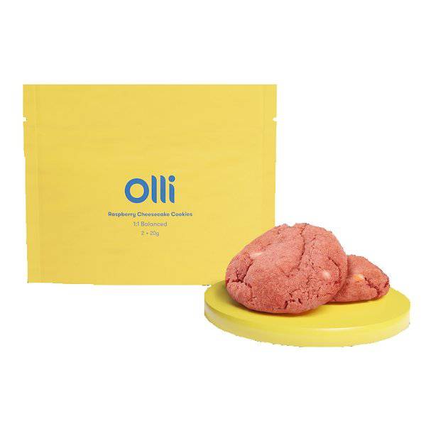 A pack of Olli Raspberry Cheesecake Cookies with two cookies displayed in front of the packaging.