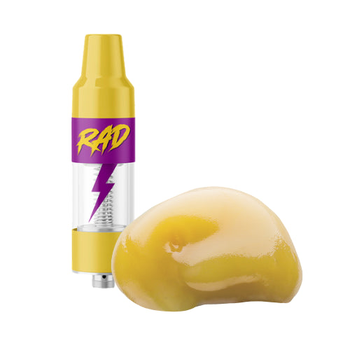 A yellow reusable 510 cartridge dab rig with a glass body and a stainless-steel heating element, alongside a piece of yellow live resin concentrate.