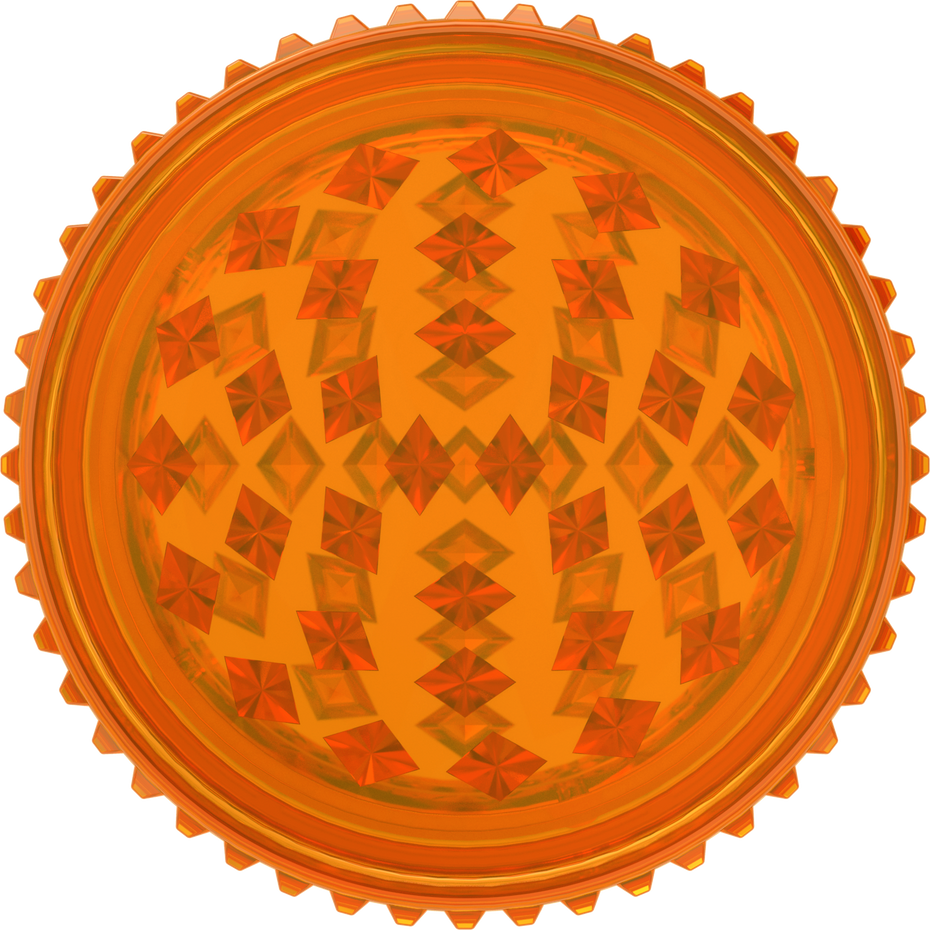 This is a grinder from Storz & Bickel made of orange plastic, pictured from the top down, as if looking directly at the top of the grinder, wihtout the lid