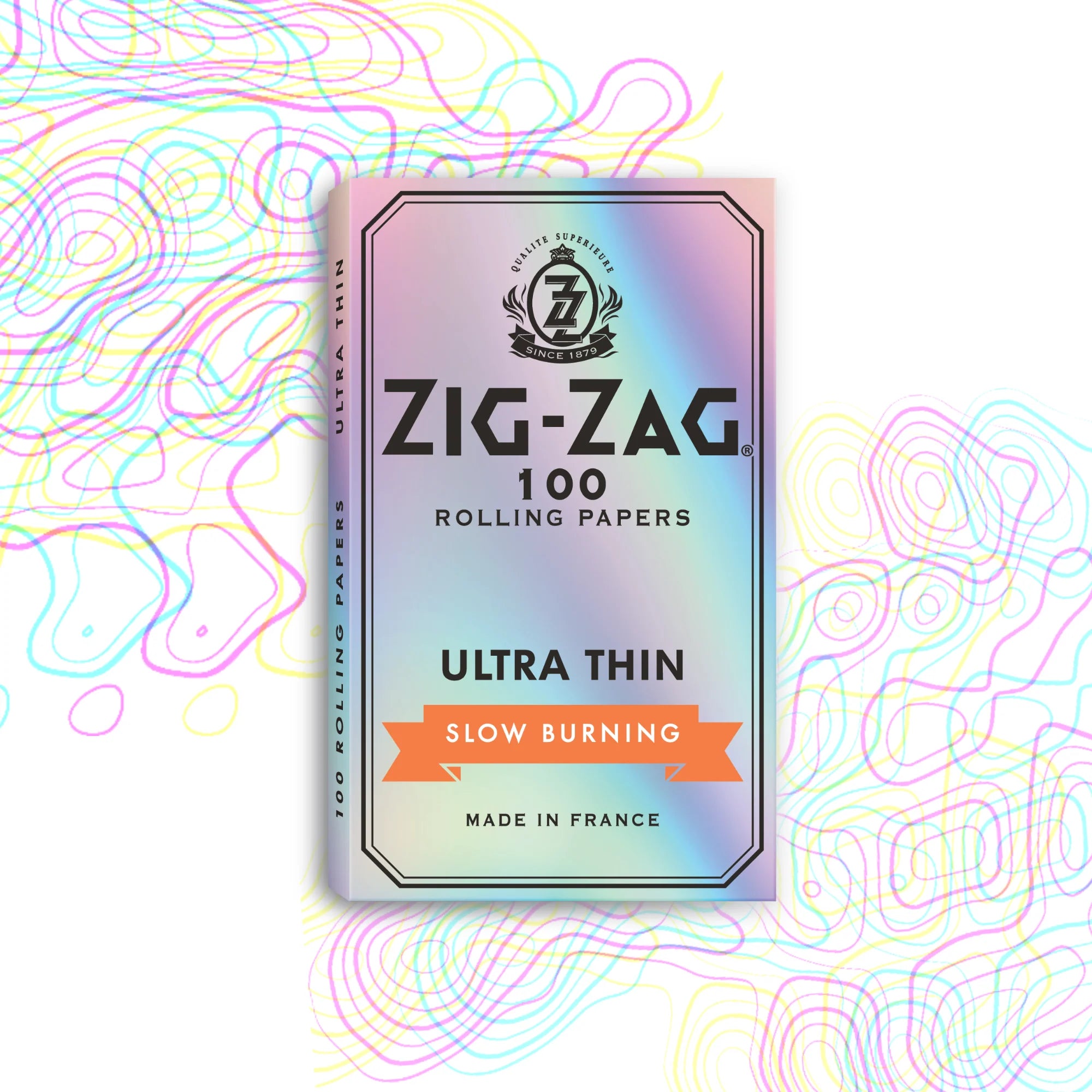 A pack of Zig-Zag ultra thin rolling papers with the brand's logo and product information displayed on the front. The pack is colored with a multicolor design and text indicating it contains 100 rolling papers, is slow burning, and made in France.