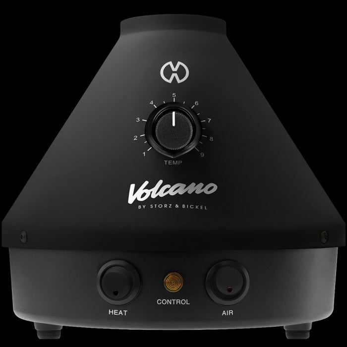 A black Volcano Classic vaporizer with a dial for temperature control and buttons for heat and air control.