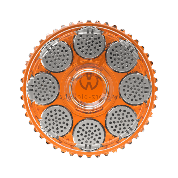 A clear orange magazine with silver dosing capsules designed for filling and storing ground herbs, featuring the Storz & Bickel logo.