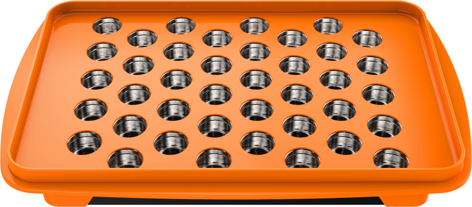 A set of accessories for filling dosing capsules, including a filling device, spatula, plunger, grinder, magazine with sealed capsules, and a scale. The grinder and magazine have orange accents.