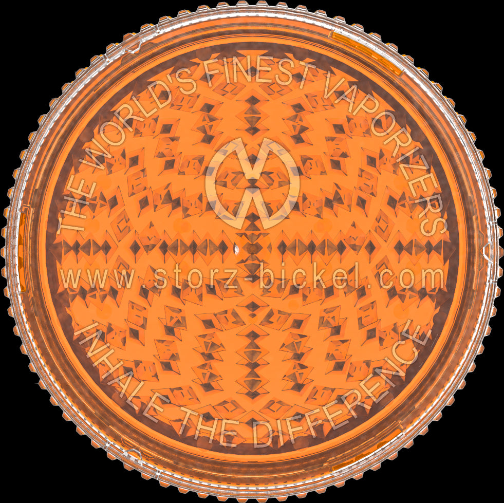 This is a grinder from Storz & Bickel made of orange plastic, pictured from the top down, as if looking directly at the top of the grinder.