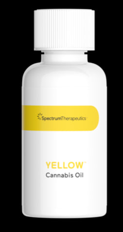 A bottle of Spectrum Therapeutics Yellow Cannabis Oil.