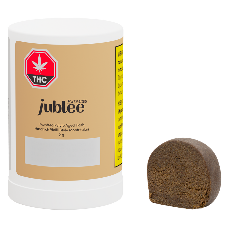Jubilee cannabis product with a white container and brown hash on a white background