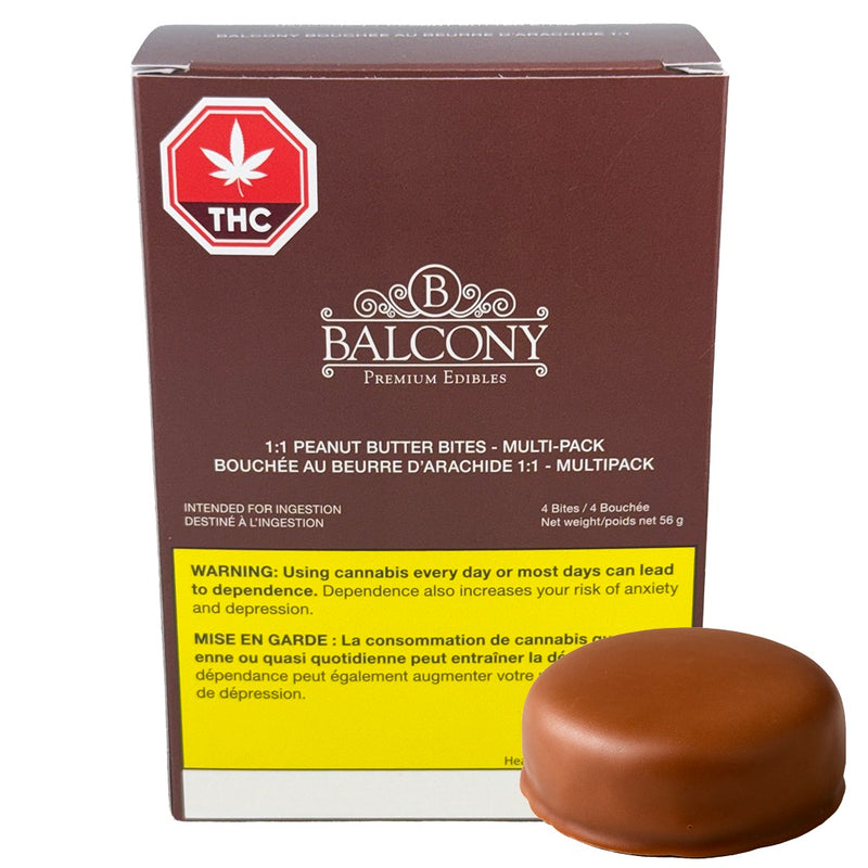 A box of Balcony Premium Edibles THC 1:1 Peanut Butter Bites Multi-Pack next to a single chocolate-covered peanut butter bite on a white background.