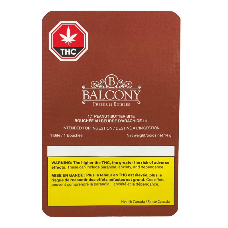 A brown rectangular package card for balcony premium edibles, featuring a red THC warning seal at the top left, white branding text, and a yellow warning panel at the bottom, shown on a plain white background.