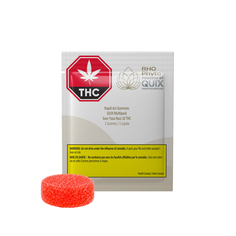 A package of RHO PHOTOSYNTHETIC QUIX THC Rapid Act Gummies, shown with a single round, textured orange-red gummy candy in front of the white and yellow packaging on a solid white background.