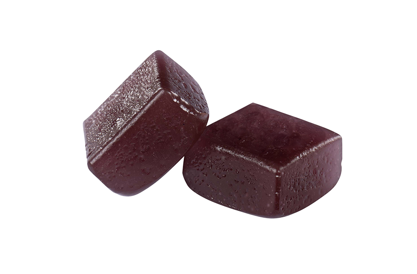 Two dark purple square-shaped tablets on a white background