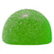 Green gummy candy with white specks on a white background