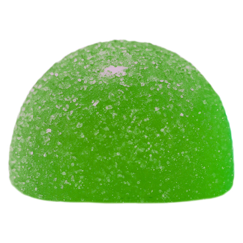 Green gummy candy with white specks on a white background