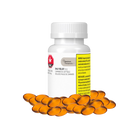 Bottle of orange capsules with a white cap on a white background