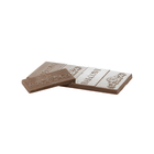 Two halves of a chocolate bar, one milk chocolate brown and one white chocolate white, with the brand name 'Balkany' embossed on the white section, set against a plain white background.