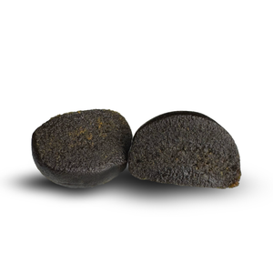 Two dark hash pieces on a white background