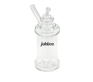 Clear glass bottle with a straw on a white background, featuring the brand 'jublee'.