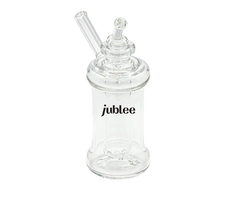 Clear glass bottle with a straw on a white background, featuring the brand 'jublee'.