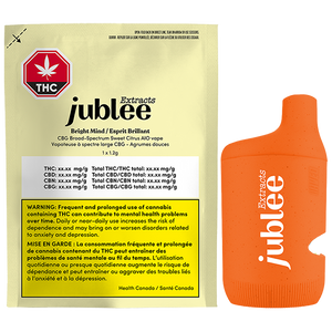 Orange vape device with 'jublee' branding next to a yellow packaging sleeve with the same branding.