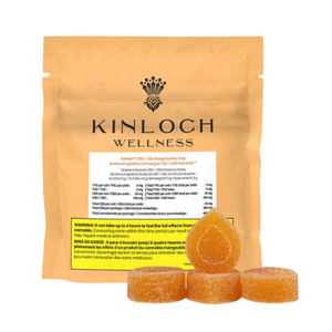 Packaging for Kinloch Wellness CBG + CBD Mango Gummy Drops with three gummy candies in the front. The packaging is primarily orange and gold with product information and branding visible.