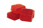 Red jelly cubes on a white background