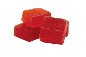 Red jelly cubes on a white background