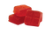 Red jelly cubes on a white background