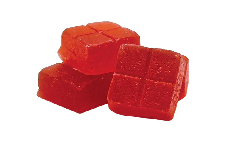 Red jelly cubes on a white background