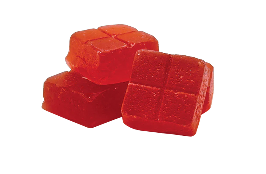 Red jelly cubes on a white background