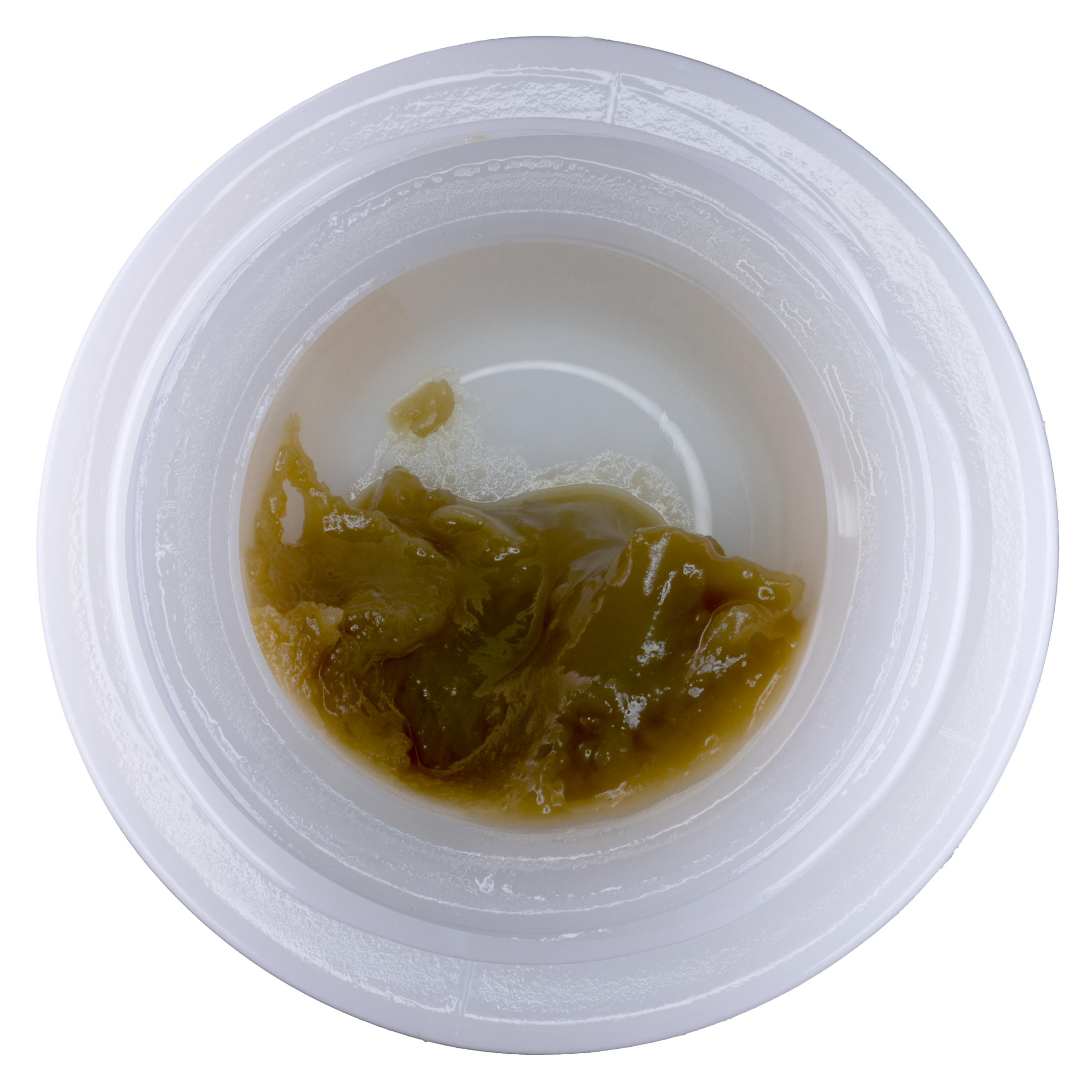 Small container with brownish substance on a white background