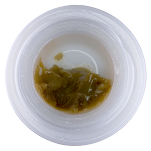 Small container with brownish substance on a white background