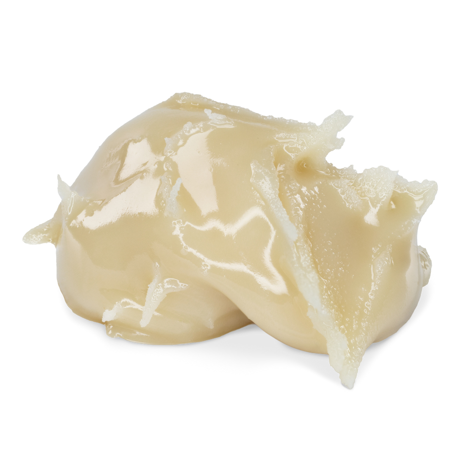 A scoop of creamy,live hash rosin a glossy, semi-translucent texture, photographed on a solid white background.