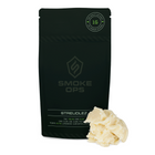 A black resealable pouch labeled SMOKE OPS Streudlez with a small pile of pale cream wax product placed in front on a white background.