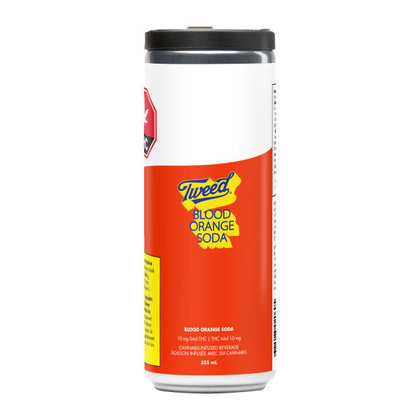A single can of Tweed Blood Orange Soda on a plain white background. The can has a white upper section, a large orange-red lower section, a yellow graphic accent, and a black lid.