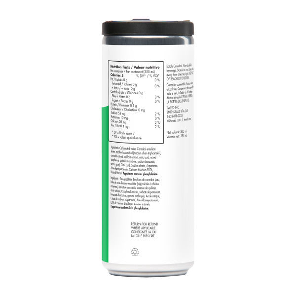 A tall white cylindrical bottle with a black cap, photographed from the back against a plain white background. The label shows nutrition facts, ingredients, and a green vertical band near the lower left side.