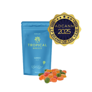 Blue package of 'Tropical Breeze' gummies with a gold ADCANN 2025 brand award on a white background