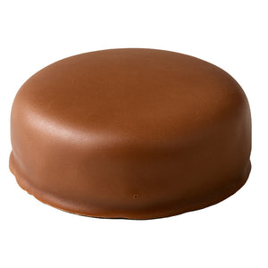 A round chocolate-covered dessert or cake with a smooth, glossy brown glaze, isolated on a white background.