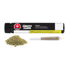 A black and white cannabis joint packaging tube labeled 'THC Cannabis Council' with a yellow warning label, shown above a small pile of green-brown ground cannabis and a single rolled joint on a plain white background.