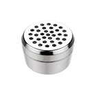 A silver dosing capsule with a filling pad inside, designed for gap filler use with finely ground herbs.
