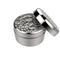 A silver dosing capsule with a filling pad inside, designed for gap filler use with finely ground herbs.