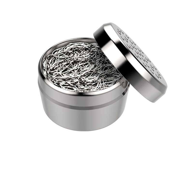 A silver dosing capsule with a filling pad inside, designed for gap filler use with finely ground herbs.