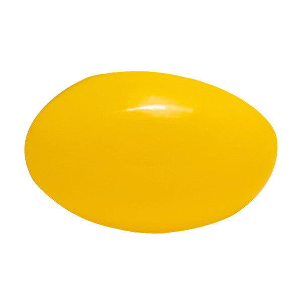 single yellow softgel on white background