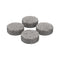 A set of four small, round, grey filling pads designed for use with a vaporizer.